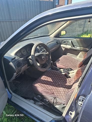 fit shuttle: Mazda 323: 2002 г., 1.6 л, Ручные, Бензин, Хэтчбэк — 8