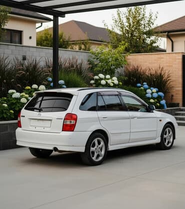 глушитель на опель зафира а: Mazda Familia: 2001 г., 2 л, Автомат, Бензиновая, Универсал — 1