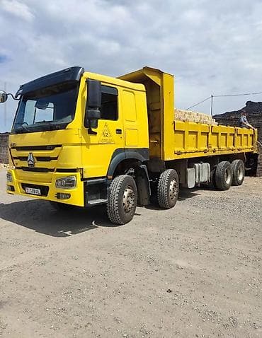Унаа: Самосвал Howo (CNHTC) 371, желтый. - Колесная формула 6x4. - Мощность — 9