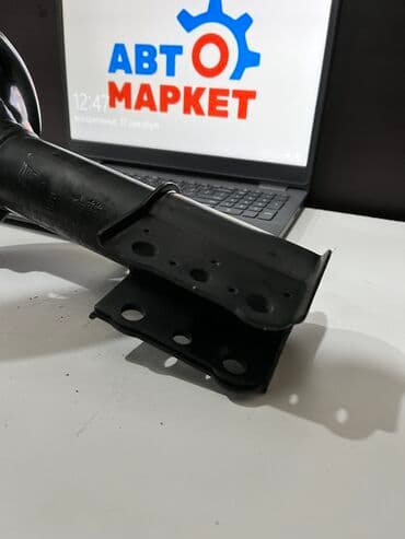 gd: Передний амортизатор Mazda 1992 г., Новый — 3