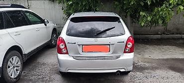 Mazda 323: 2003 г., 2 л, Механика, Бензин, Хэтчбэк