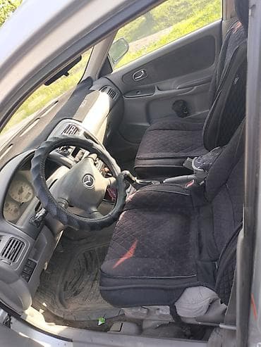 керме тоо: Mazda 626: 1999 г., 1.8 л, Кол менен иштөөчү, Бензин, Седан — 2