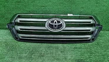 Лючки бензобака: Решетка радиатора Toyota Оригинал — 1