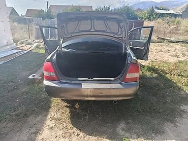 купить моторную лодку: Mazda Familia: 2001 г., Автомат, Седан — 6