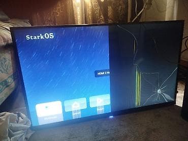 выбор: Телевизор StarkOS (модель не указана), диагональ около 40–50" — 1