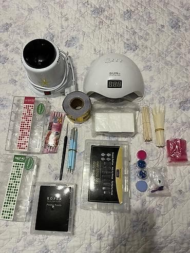 Набор для маникюра В комплекте: - УФ/LED лампа SUN 5. -