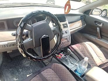 corolla s: Nissan Teana I (J31), черный седан бизнес-класса. Основные — 3