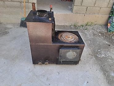 Металлическая печь-буржуйка с варочной поверхностью и водяным контуром