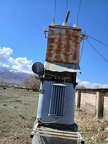 трансбой высокого давления: Масляный силовой трансформатор на опоре мощностью 100 кВт — 2