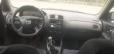 roewe rx5: Mazda 323: 2000 г., 1.8 л, Механика, Бензин, Универсал — 1