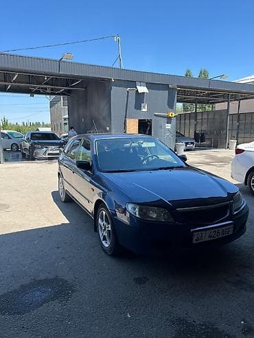 Транспорт: Mazda 323: 2002 г., 1.6 л, Механика, Бензин, Хэтчбэк — 1