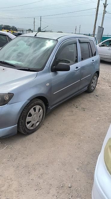 Mazda Demio: 2004 г., 1.5 л, Автомат, Бензин, Хэтчбэк — 2