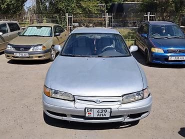 колпачки: Mazda Cronos: 1992 г., 2 л, Механика, Бензин, Седан — 1