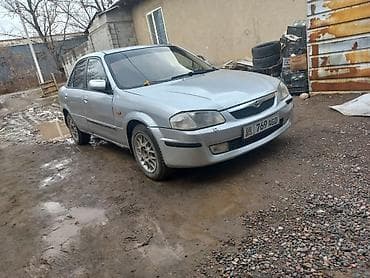 h rv: Mazda 323: 2001 г., Механика, Седан — 2