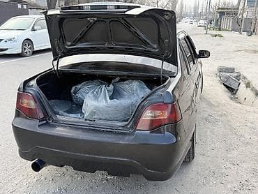 34 кузов: Нексия Седан черного цвета с доработанным экстерьером. Основные — 6