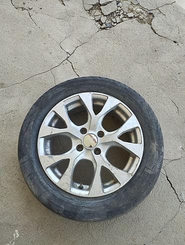 Унаа: Литой диск с шиной R15 - Диаметр диска: 15" - Крепёж: 4 отверстия — 1