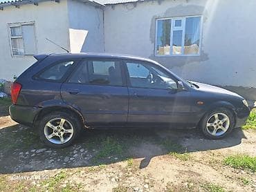 fit shuttle: Mazda 323: 2002 г., 1.6 л, Ручные, Бензин, Хэтчбэк — 9