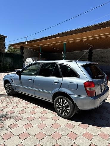 атего 1229: Mazda Familia: 1998 г., 1.8 л, Автомат, Бензин, Универсал — 3