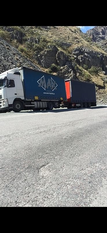 накопительный бачок: Тентованный автопоезд для дальних грузоперевозок - Тягач: Volvo FH — 2