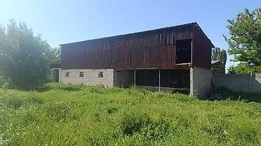 Продается хозяйственная постройка/ангар на участке с ограждением из