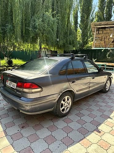 Унаа сатуу: Mazda 626: 1999 г., 1.8 л, Кол менен иштөөчү, Бензин, Седан — 4