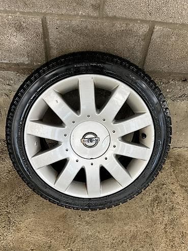 Шины и диски: Литой диск Nissan с шиной Hankook - Оригинальный легкосплавный диск — 1