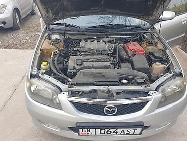 Транспорт: Mazda 323: 2003 г., 1.6 л, Автомат, Бензин, Лифтбек — 10