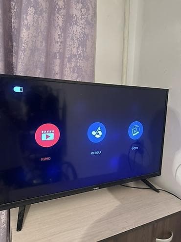 tv zona: Телевизор VISN, диагональ примерно 32–40". Тонкие рамки, устойчивые — 2
