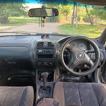 глушители авто: Mazda Familia: 1999 г., 1.5 л, Автомат, Бензин, Хэтчбэк — 5