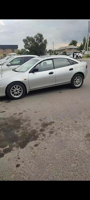 Унаа: Mazda 323: 1996 г., 0.5 л, Кол менен иштөөчү, Бензин, Лифтбек — 3
