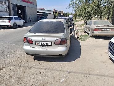 byd e5: Nissan Primera: 2001 г., Механика, Седан — 4