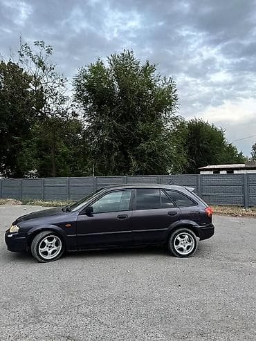 in car: Mazda 323: 1999 г., Бензин, Хэтчбэк — 6