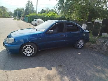 Транспорт: Daewoo Lanos: 1999 г., Бензин, Седан — 2