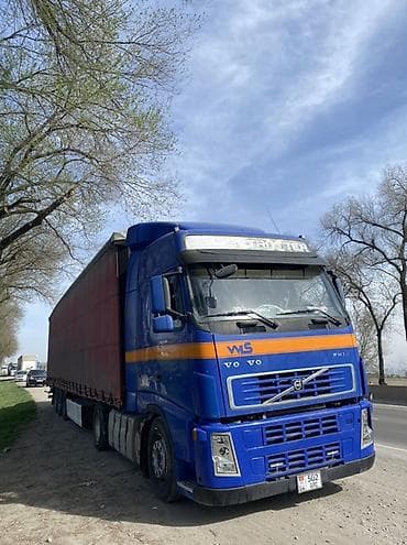 ман man: Тягач, Volvo, 2003 г., Шторный — 1