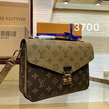Сумки: Сумка кросс-боди Louis Vuitton с фирменным монограммным канвасом — 1