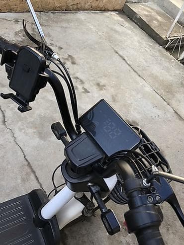 Электроскутер городского типа с двумя сиденьями Описание и