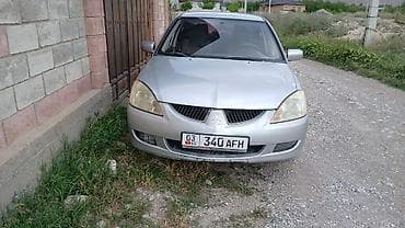 электромобиль лабо: Mitsubishi Lancer: 2002 г., Механика, Бензин, Седан — 4