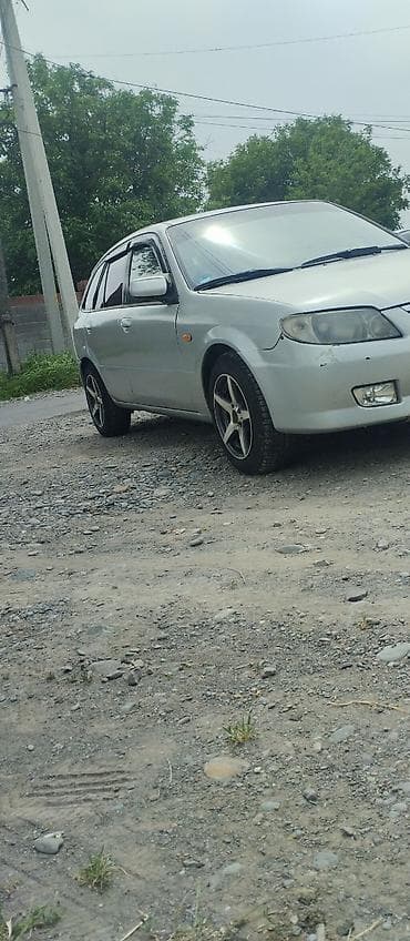 авто мазда: Mazda 323: 2001 г., 1.6 л, Механика, Газ, Универсал — 7