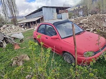 прибор нексия 2: Компактный городской седан красного цвета. Кузов: - 4 двери, габариты — 2