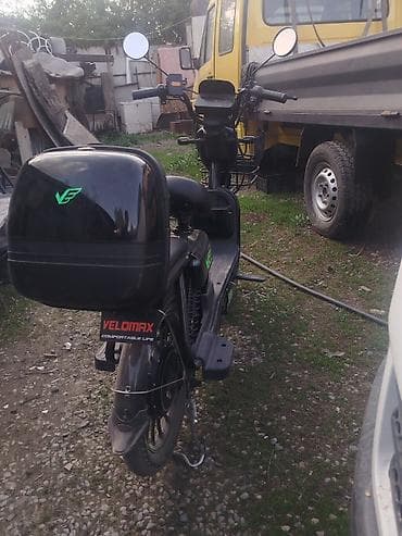 мото электрический: Электроскутер VELOMAX (городской) - Компоновка «степ‑тру» с низкой — 2