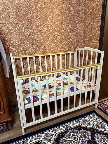 Детская кроватка с продольным маятниковым механизмом. - Материал