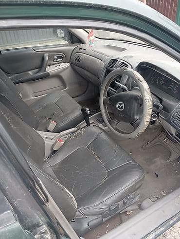 mazda cronos: Mazda 323: 2013 г., 1.5 л, Автомат, Бензин, Седан — 5