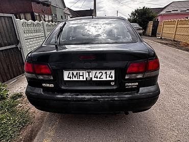 Унаа сатуу: Mazda 626: 1997 г., 1.8 л, Кол менен иштөөчү, Бензин, Хетчбек — 3