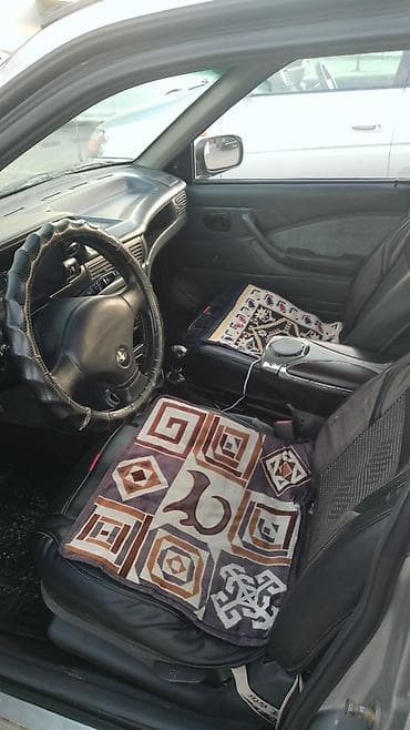 Daewoo Nexia, серебристый седан, 4 двери. Основные характеристики: -