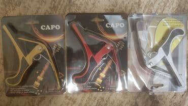 купить гитару в бишкеке бу: Каподастр есть в наличии: металлические и пластиковые . есть доставка — 8