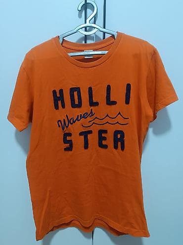Футболки: Оранжевая футболка hollister унисекс с темно-синей надписью — 1