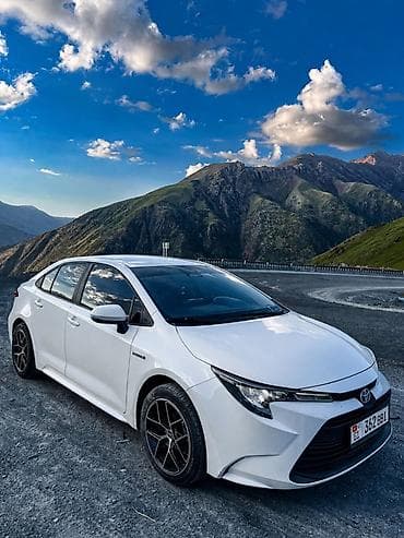 byd e2 2019: Toyota Corolla: 2023 г., 1.8 л, Вариатор, Гибрид, Седан — 3