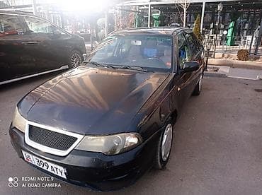 ford focus 2002: Седан темно-синего цвета на киргизских номерах (KG, номер 399 ATY) — 2