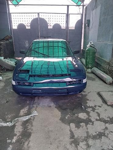 Башкалар: Редкий японский седан начала 1990‑х с выдвижными фарами, темно‑синего — 3