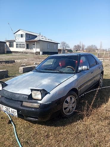 Mazda 323: 1990 г., Лифтбек